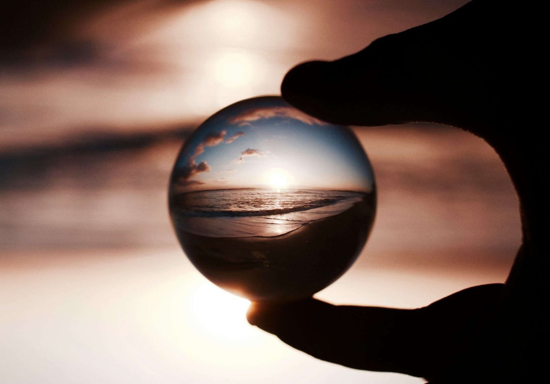 selective focus photography of glass globe with picture of seat